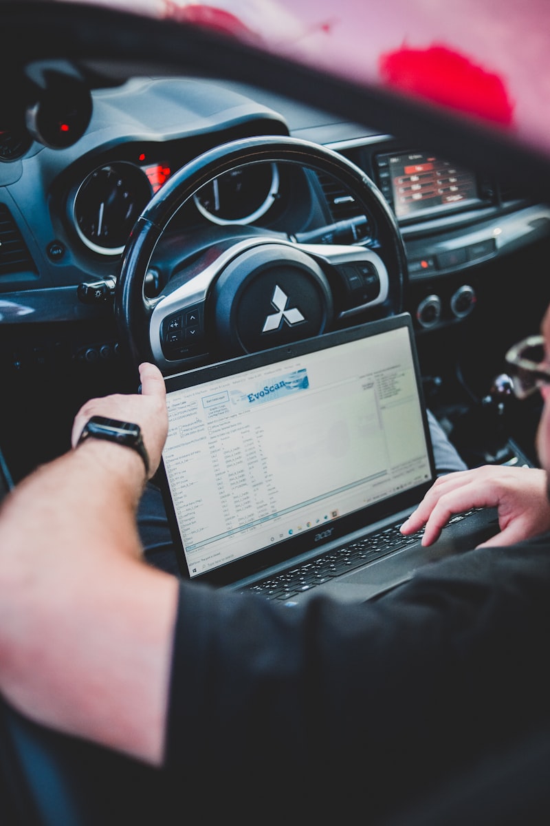 Mechanic running a diagnostic scan on a tablet