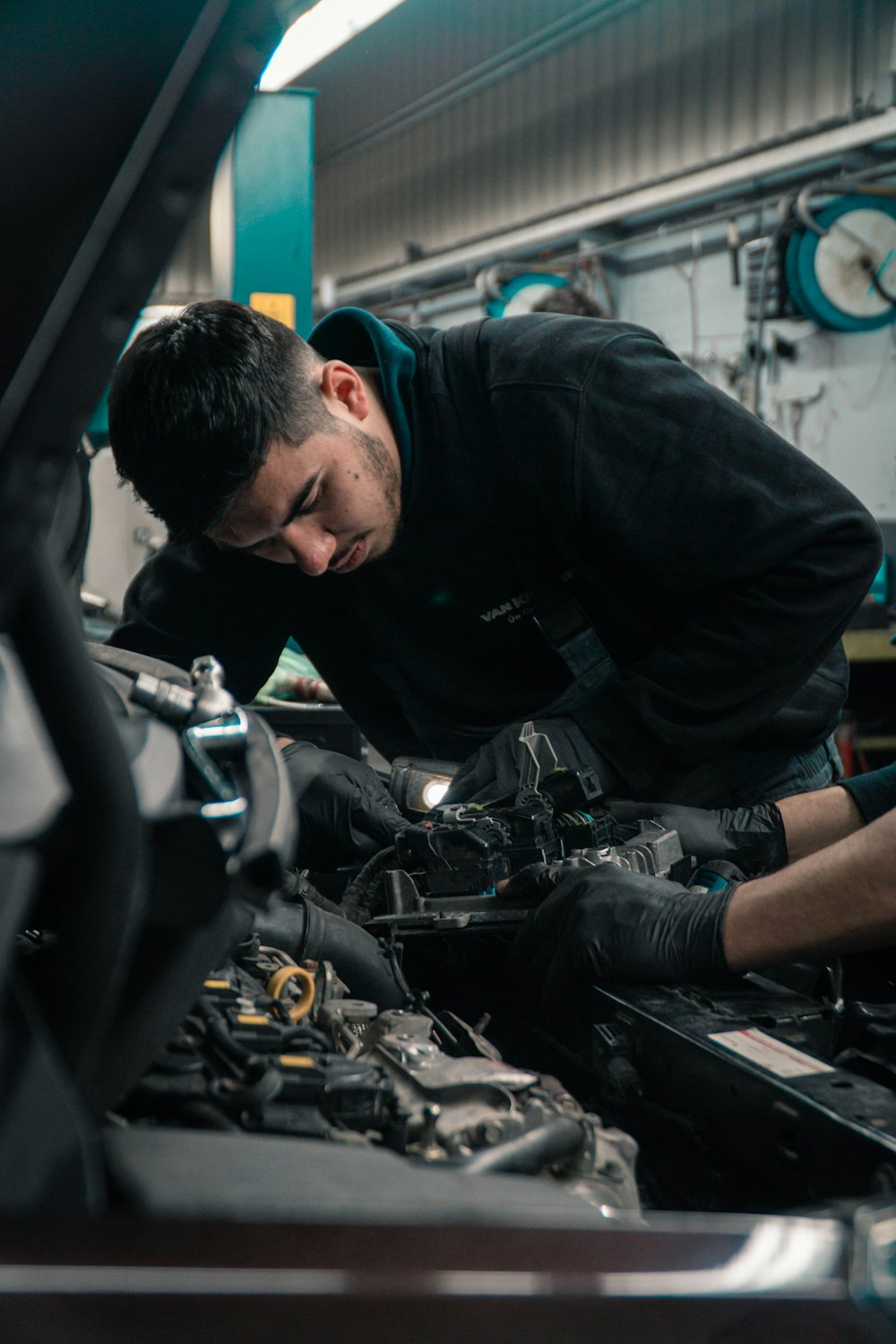 Qualified mechanic carrying out repairs
